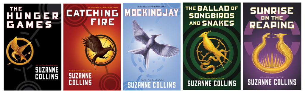 A lineup of all the hunger games books; originnal, Catching Fire, Mockingjay, The Ballad of Songbirds and Snakes, and Sunrise on the Reaping.